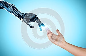 ROBO AND HUMAN HAND artificial intelligence photo