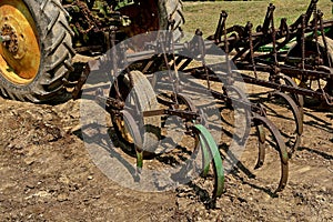 Field cultivator hooked to a tractor hitch