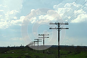 Field with electrity pillars