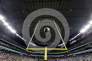 Field Goal Posts in a large indoor football stadium during a game.