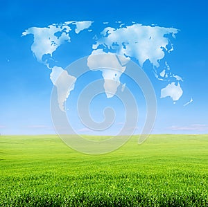 Field of grass with world shaped clouds