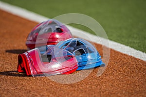 Field hockey equipment on green grass