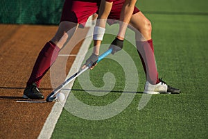 Field Hockey player, ready to pass the ball to a team mate