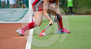 Field Hockey player, ready to pass the ball to a team mate