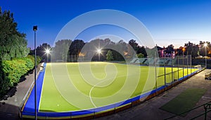 Field hockey stadium with lights at night