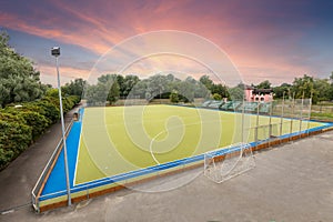 Field hockey stadium sports arena at sunset