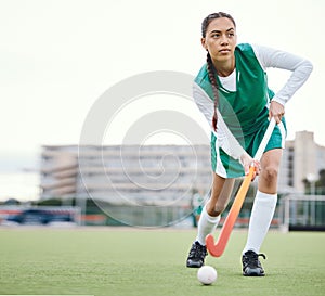 Field, hockey and woman running in game, tournament or competition with ball, stick and action on artificial grass