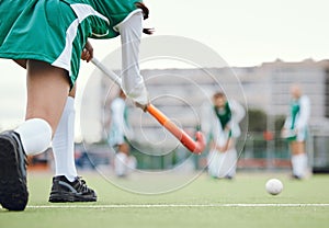 Field, hockey and woman running in game, tournament or competition with ball, stick and team on artificial grass. Sports