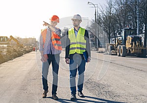 Field Inspectors at Building Construction Site. Land inspector checking a construction site