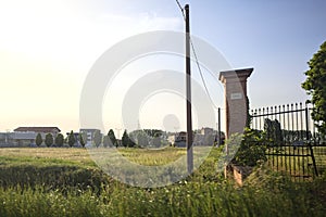 Field and manor next to a village