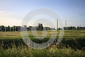 Field and manor next to a village