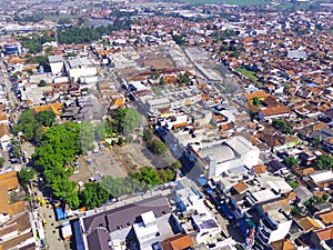 A FIELD IN THE MIDDLE OF URBAN AREA - STOCK PHOTO