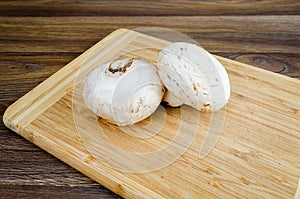 Field mushrooms on a cutting board