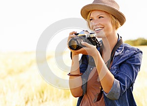 Field, photographer and woman with a camera, adventure and thinking with ideas, nature and memory. Person, countryside