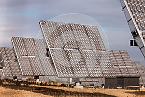 Field of photovoltaic solar panels gathering energy.