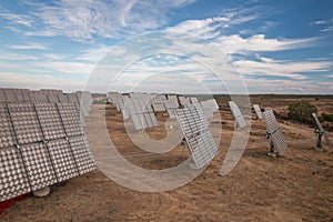 Field of photovoltaic solar panels gathering energy.