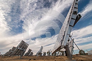 Field of photovoltaic solar panels gathering energy.