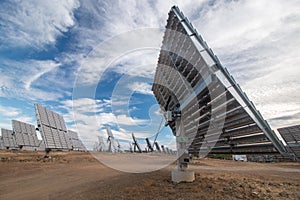 Field of photovoltaic solar panels gathering energy.