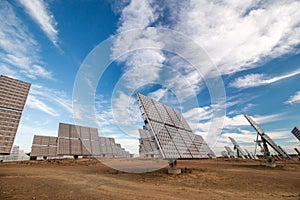 Field of photovoltaic solar panels gathering energy.