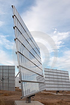 Field of photovoltaic solar panels gathering energy.