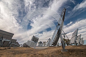 Field of photovoltaic solar panels gathering energy.