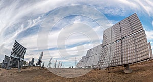 Field of photovoltaic solar panels gathering energy.