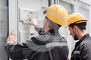 Field service crew testing electronics or inspecting electrical