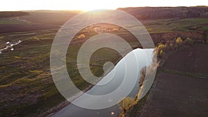 field sunset greenery river aerial view drone