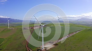 Field, wind turbines and clean energy with drone, outdoor and power supply for environment. Electrical engineering