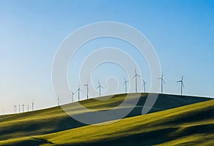 a field with wind turbines on it and a clear blue sky