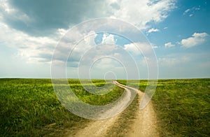 Field winding road through photo