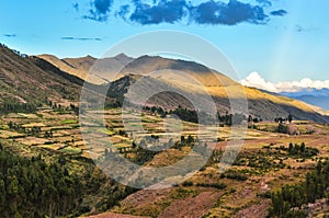 The fields around the ruins of the Puka Pukara in Cusco, Peru photo