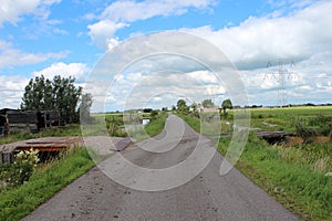 Fields and meadows along Hollandsche IJssel river with blue sky and white clouds. The polder behind the is named zuidplaspolder an