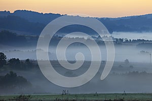 Morning fog over fields and meadows of Podkarpacie region in Poland