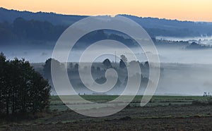 Morning fog over fields and meadows of Podkarpacie region in Poland