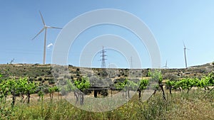 Fields with windmills in Larnaca, Cyprus. Renewable energy resource of alternative energy production