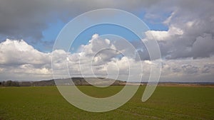 Fieldsin the Wallonian countryside, with terril hill in the background photo