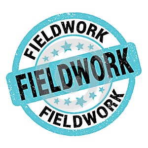 FIELDWORK text written on blue-black round stamp sign