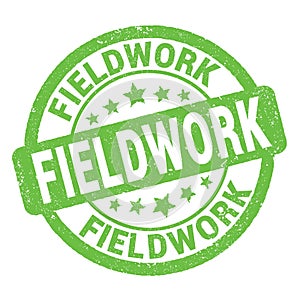 FIELDWORK text written on green round stamp sign