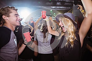 Fiends dancing in nightclub