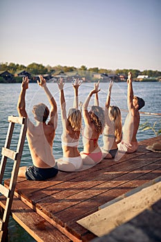 Fiends spend leisure time together at vacation at dock