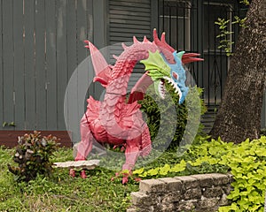 Fierce plastic dragon statue in front of a building in Dallas, Texas.