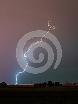 Fierce thunderbolt of lightning hits the ground.
