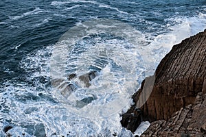 Waves breaking against the rocks