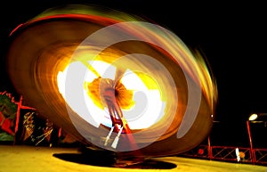 Fiery dance by the spinning wheels photo