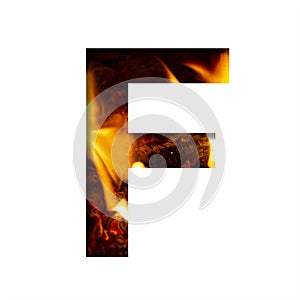 Fiery letter F from white paper on a background of fire in a fireplace or stove, decorative alphabet