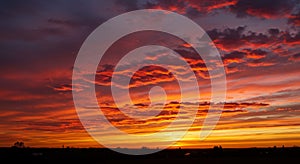 Fiery Orange And Red Sunset Sky With Dramatic Cloud Formations