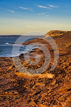 Fiery red wild sandstone coast at sunset, Western Australia