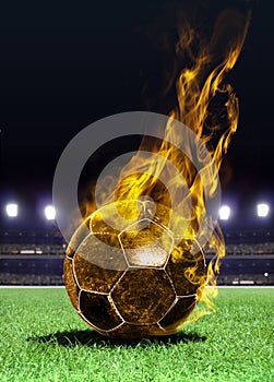 Fiery soccer ball on field