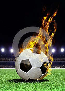 Fiery soccer ball on stadium